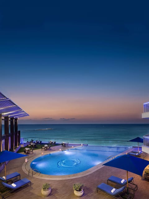 Outdoor pool, open 9:00 AM to 5:00 PM, pool umbrellas, sun loungers