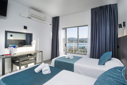 Twin Room, Sea View | Desk, laptop workspace, WiFi (free), bed sheets