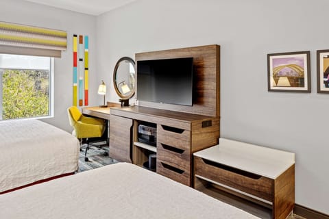 Premium bedding, desk, laptop workspace, blackout drapes