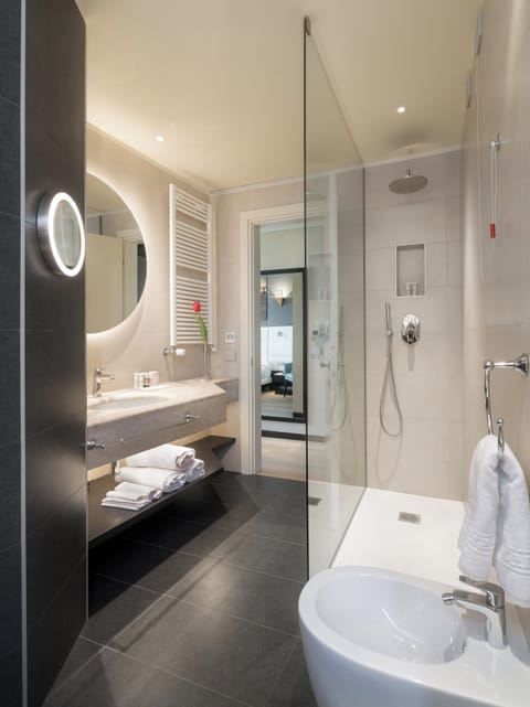 Eco-friendly toiletries, hair dryer, bidet, towels