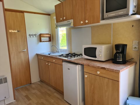 Mini-fridge, microwave, eco-friendly cleaning products, paper towels