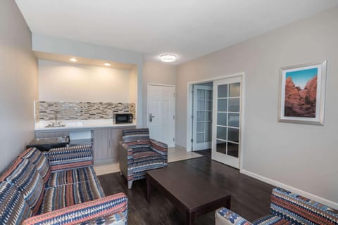 Pillowtop beds, desk, blackout drapes, iron/ironing board