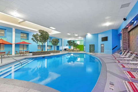 Indoor pool, open 9:00 AM to 9:00 PM, pool umbrellas, sun loungers