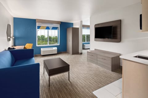 Suite, 1 King Bed | In-room safe, blackout drapes, iron/ironing board, free WiFi