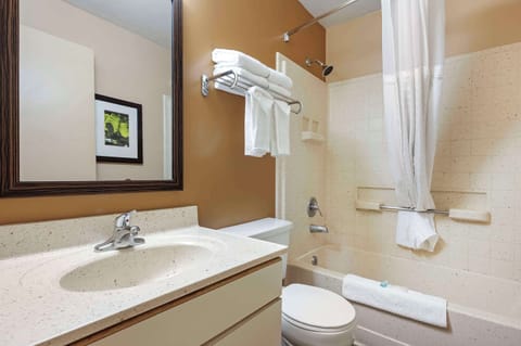Room, 1 Queen Bed, Non Smoking (Efficiency) | Bathroom | Combined shower/tub, free toiletries, hair dryer, towels