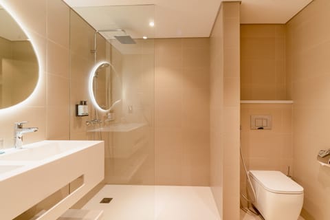 Eco-friendly toiletries, hair dryer, slippers, bidet