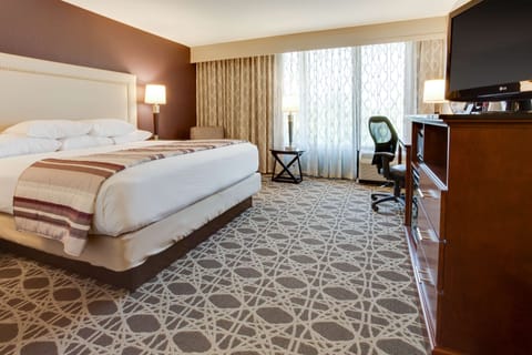 Desk, laptop workspace, blackout drapes, iron/ironing board