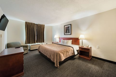 Desk, laptop workspace, blackout drapes, iron/ironing board