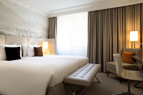 Down comforters, pillowtop beds, in-room safe, desk