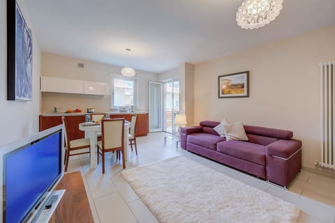 Family Apartment, Multiple Bedrooms (Casa Margherita Few Minutes From Lake) | Living area | 21-inch flat-screen TV with cable channels, TV