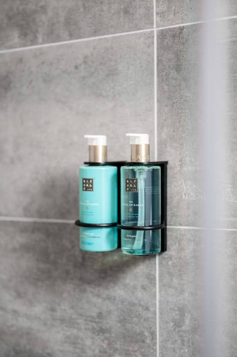 Shower, rainfall showerhead, hair dryer, towels