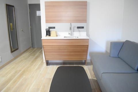 Desk, laptop workspace, blackout drapes, iron/ironing board