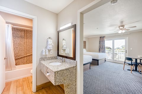 Standard Room, 2 Queen Beds, Partial Ocean View | Desk, iron/ironing board, rollaway beds, free WiFi