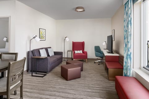 Suite, 1 King Bed | Living area | 55-inch flat-screen TV with cable channels, TV, MP3 dock