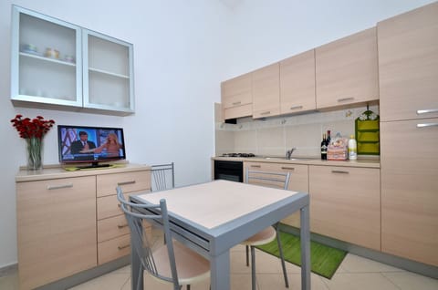 Family Condo, 2 Bedrooms, Private Pool, Garden View (Località Piricone) | Private kitchenette | Full-size fridge, cookware/dishes/utensils