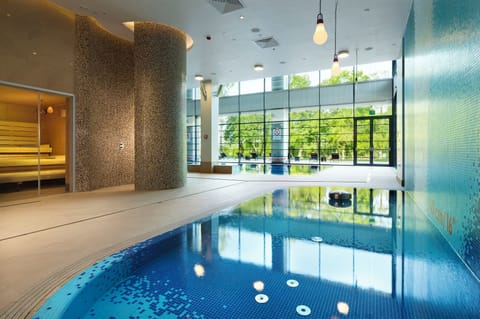 Indoor pool, open 7:00 AM to 10:00 PM, sun loungers