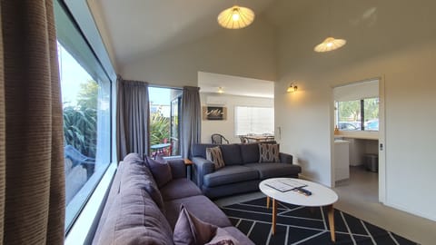 Two Bedroom Townhouse | Living area | 28-inch TV with satellite channels