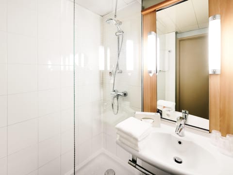 Shower, eco-friendly toiletries, hair dryer, towels