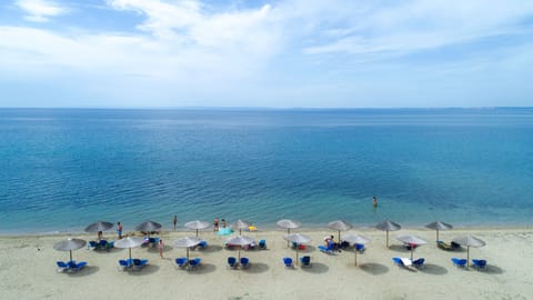 On the beach, sun loungers, beach towels, snorkeling