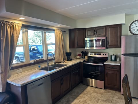 Family Suite, 2 Bedrooms | Private kitchen | Full-size fridge, microwave, coffee/tea maker, freezer