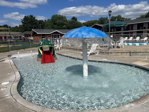 Seasonal outdoor pool, open 9 AM to 10:00 PM, pool umbrellas