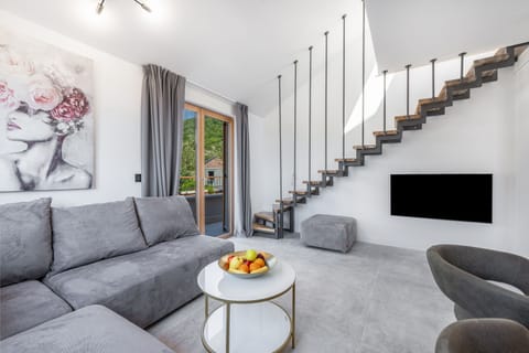 Family Apartment, 3 Bedrooms, Sea View | Living area | 40-inch LCD TV with cable channels, TV