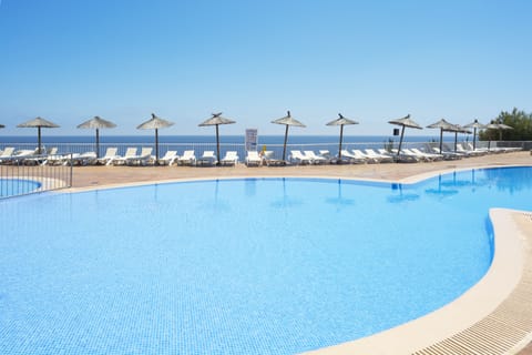Outdoor pool, open 10:00 AM to 6:00 PM, pool umbrellas, sun loungers