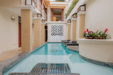 Outdoor pool, open 8 AM to 10:00 PM, pool umbrellas, sun loungers