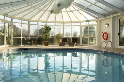 Indoor pool, open 7:00 AM to 9:00 PM, sun loungers