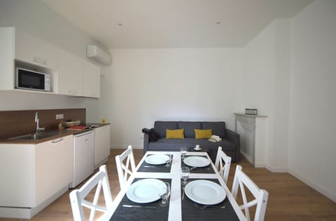 Exclusive Apartment | Living area | 100-cm flat-screen TV with digital channels, TV, offices