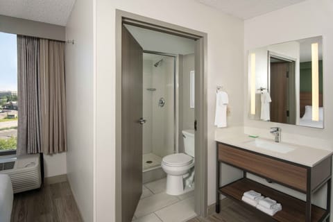 Designer toiletries, hair dryer, towels