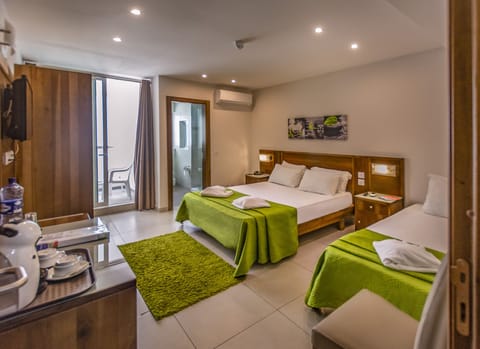 Triple Room, Balcony | In-room safe, desk, blackout drapes, iron/ironing board