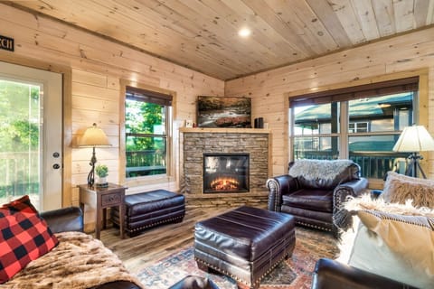 Family Cabin | Living room | 65-inch Smart TV with cable channels, TV, fireplace