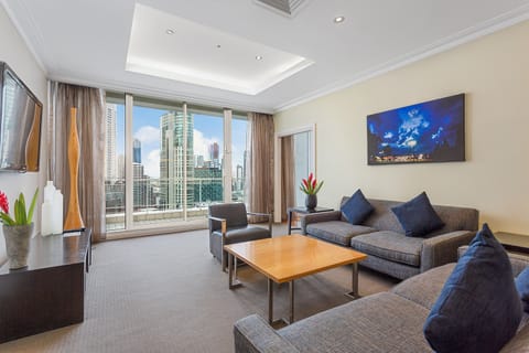 Penthouse Crown Suite | Living area | 48-inch LCD TV with cable channels, TV