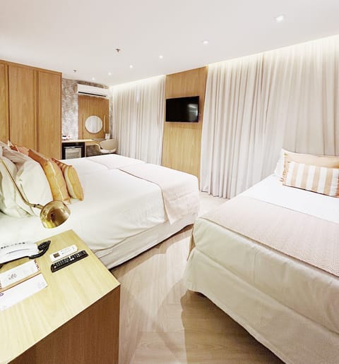 Deluxe Triple Room | Hypo-allergenic bedding, down comforters, minibar, in-room safe