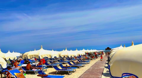 Beach cabanas, sun loungers, beach umbrellas