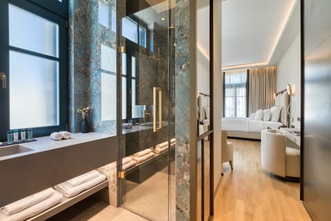 Designer toiletries, hair dryer, bathrobes, slippers