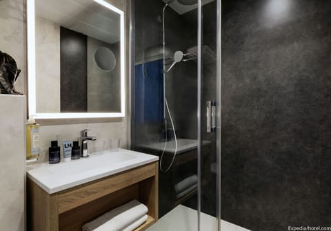 Shower, eco-friendly toiletries, hair dryer, towels