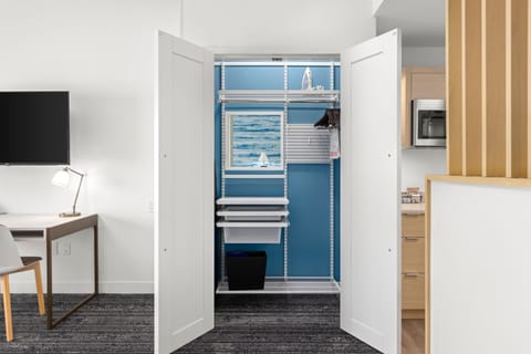 Premium bedding, laptop workspace, blackout drapes, iron/ironing board