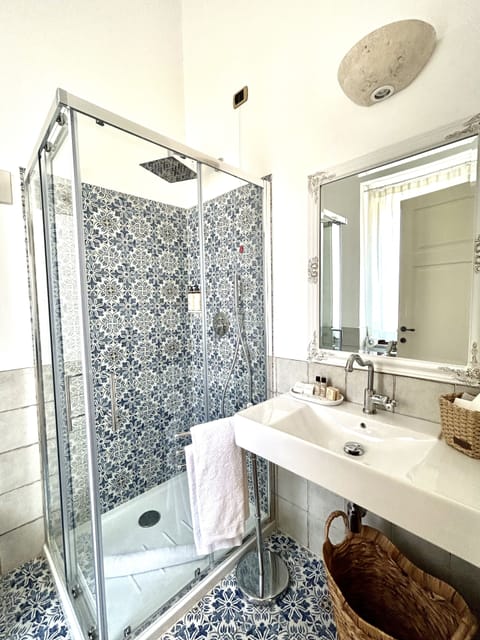 Comfort Suite, 1 King Bed with Sofa bed, Terrace, Garden View | Bathroom | Shower, rainfall showerhead, free toiletries, hair dryer