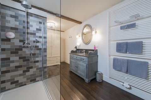 Shower, rainfall showerhead, hair dryer, towels