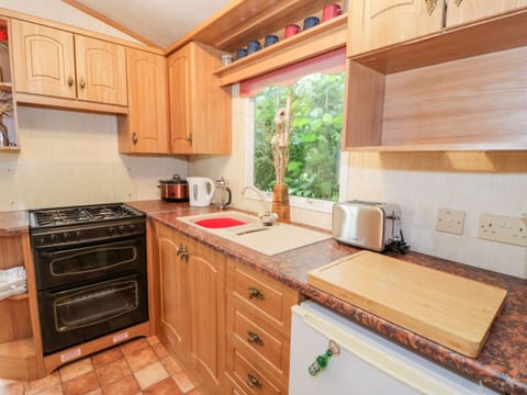 Fridge, electric kettle, cookware/dishes/utensils