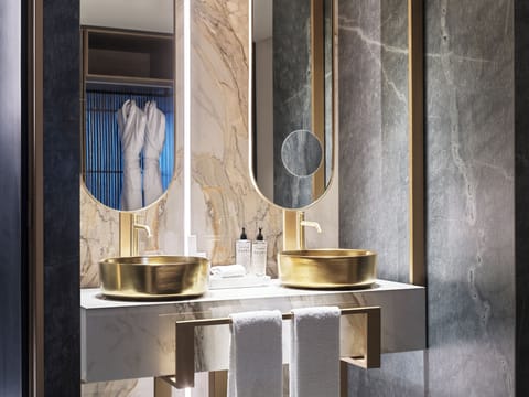 Suite, Balcony, 1 King Bed | Bathroom | Shower, eco-friendly toiletries, hair dryer, bathrobes