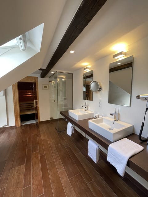 Exclusive Suite | Bathroom | Designer toiletries, hair dryer, towels, soap