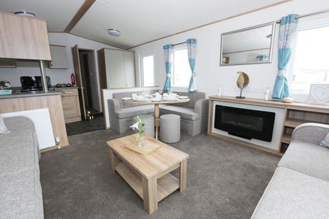 8 Berth Luxury Caravan Pet Free | Living area | Flat-screen TV