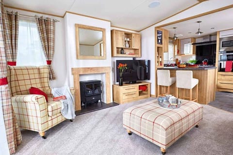 Indulgent 8 Berth Caravan with Hot Tub Pet Free | Living area | Flat-screen TV