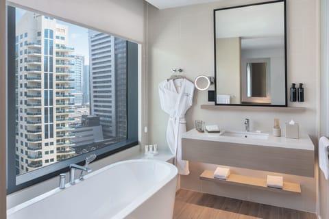 Deluxe Suite, City View | Bathroom | Bathrobes, slippers, towels