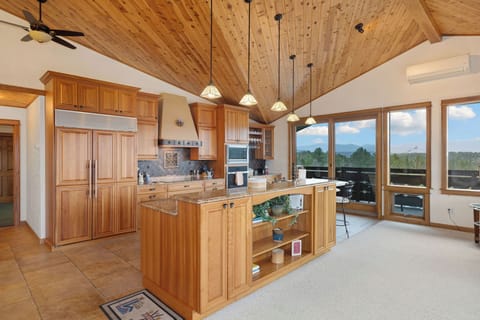 Olympic Suite | Living area | 55-inch TV with cable channels