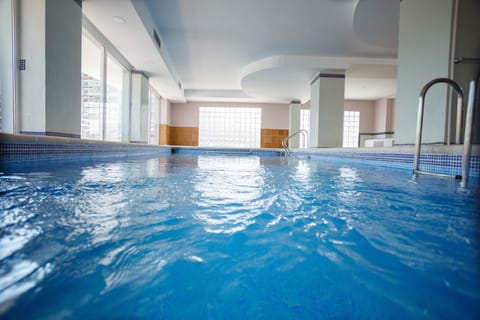 Indoor pool, outdoor pool, pool umbrellas, sun loungers