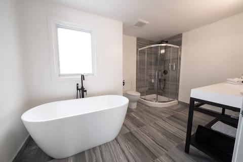 Deluxe King The Palms | Bathroom | Designer toiletries, hair dryer, towels, soap